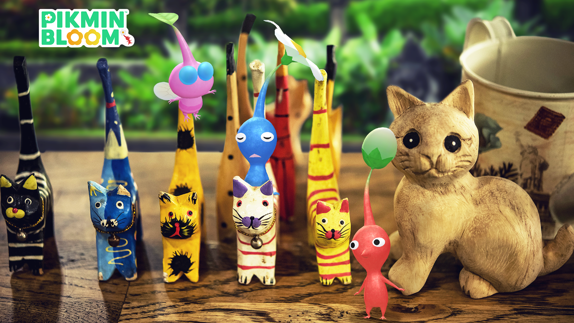 Pikmin Bloomのロゴとバリの木彫りアニマルデコピクミンが描かれた公式イベント画像